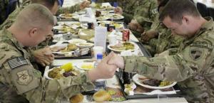 U.S. soldiers stationed in Kabul praying before Thanksgiving supper. Photo credit - http://thechristians.com/?q=node/437